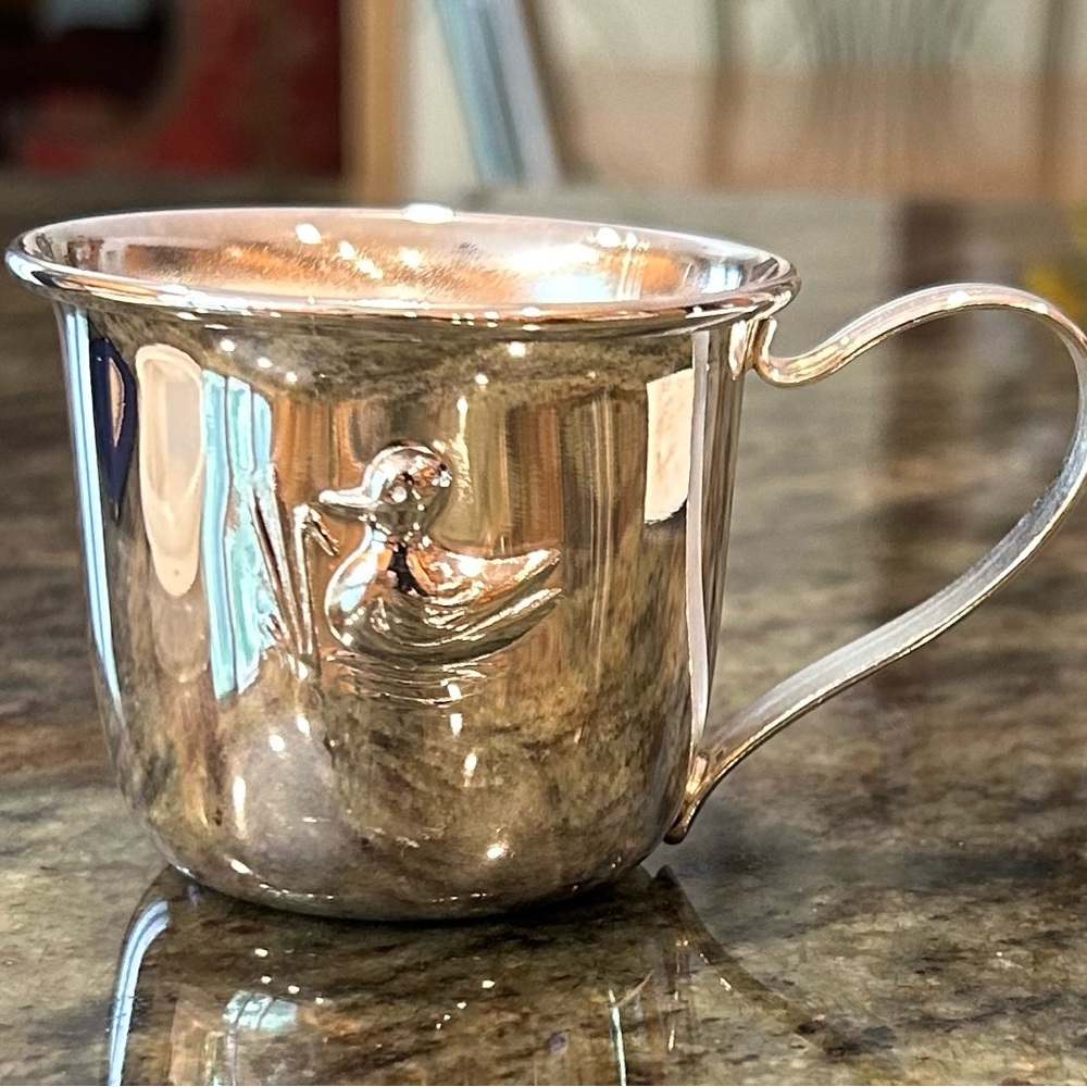 Vintage silver plated baby sippy cup with lid and box.  Embossed duck design.